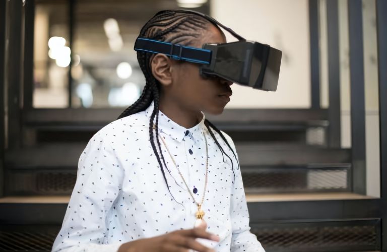 a kid using Virtual Reality goggles