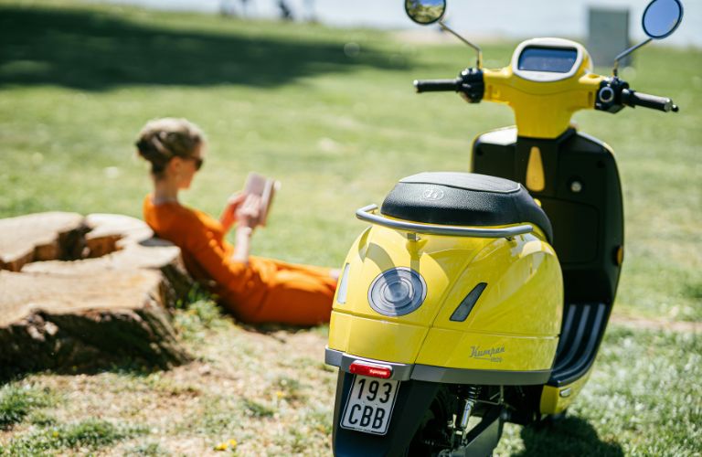 Electric Scooter parked near owner