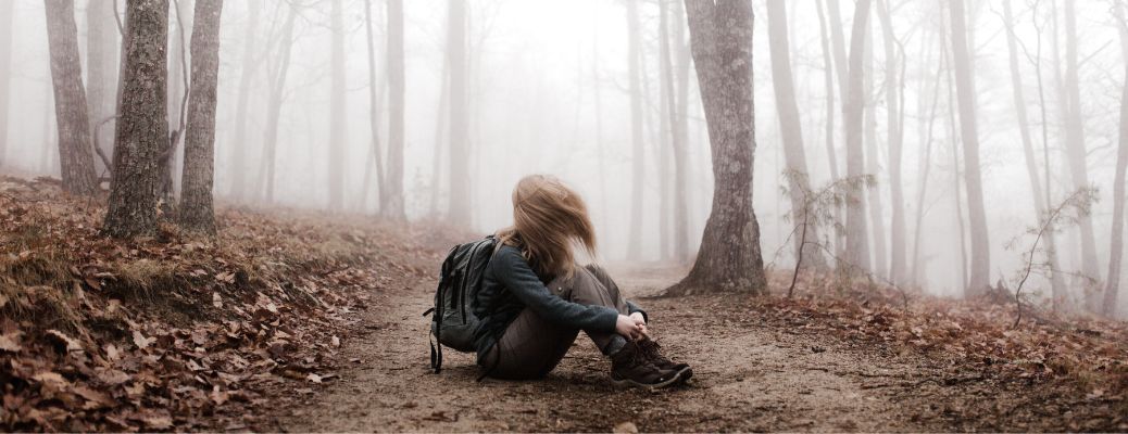 A woman in a misty forest