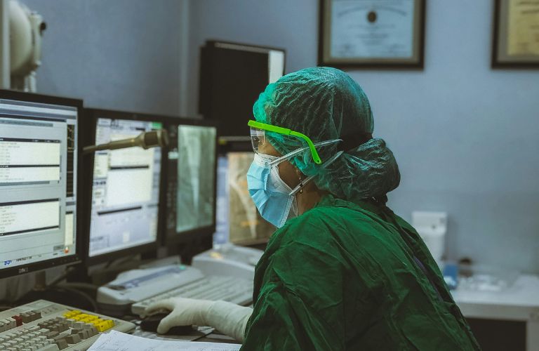 a doctor working on a computer